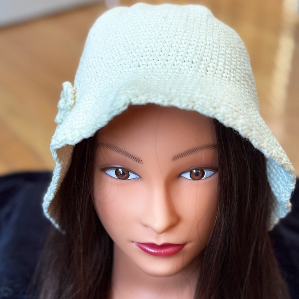 WOmen's cream color knit hat with flower